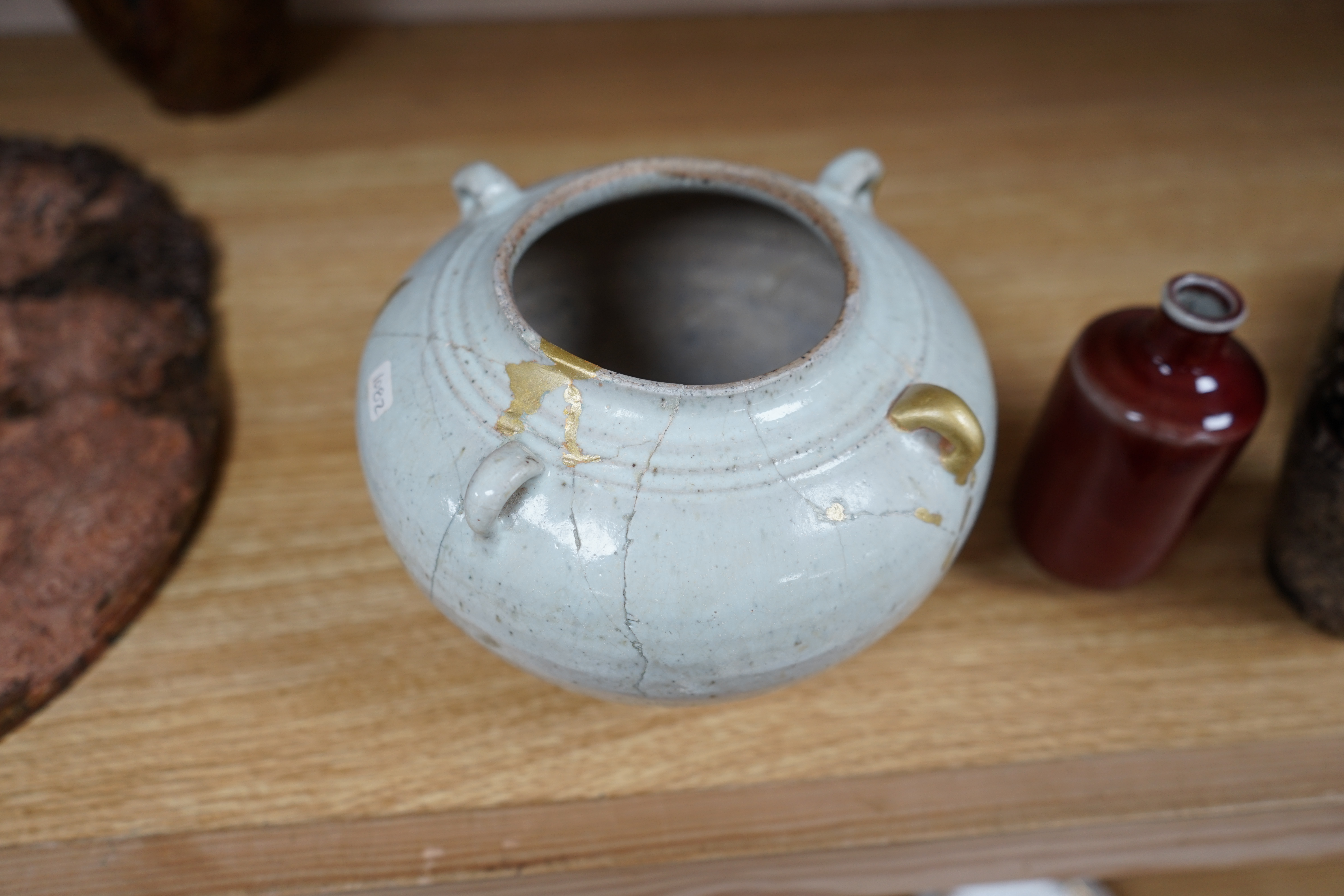 Chinese ceramics comprising a white glazed jar, Jin-Yuan dynasty, hare’s fur type bowl, a cut paper silhouette vase and a sang de boeuf glazed vase, largest 17cm in diameter (4). Condition - poor to good